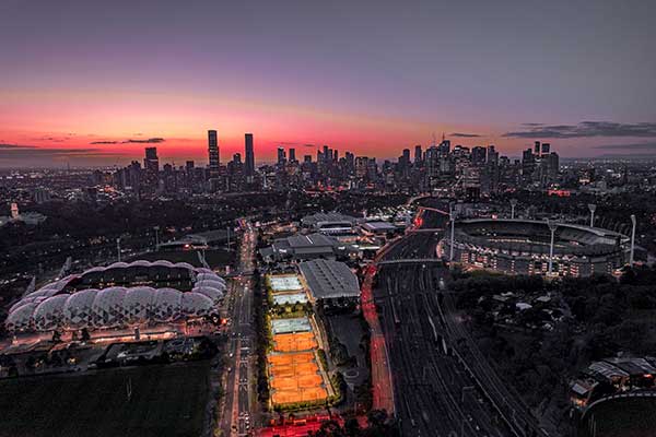 melbourne-cityscape-at-sunset-with-illuminated-sta-2024-12-12-18-24-21-utc